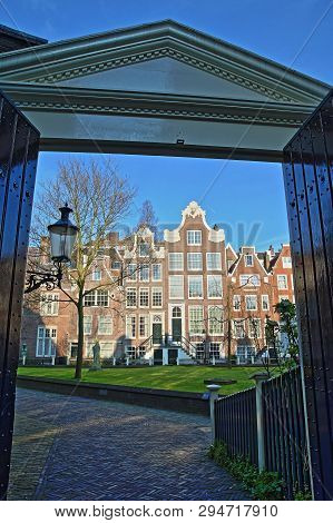Amsterdam, Netherlands - April 05, 2019: The Entrance Gate To The Internal Courtyard Of Begijnhof, O