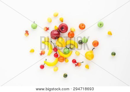 A Scattering Of Many Small Different Fruits On A White Background. Mini Copy, The Concept Of Diversi