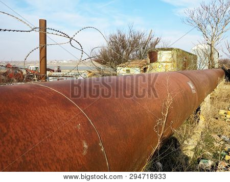 Pipeline. Large Iron Drainage Pipes Connect Two Reservoirs. Large Diameter Metal Pipe For Agricultur