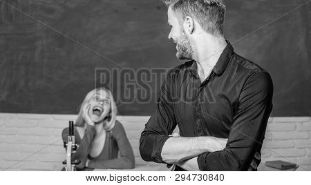 Smart And High Trained. Handsome Man Standing Hands Crossed In Classroom With Teacher. High School S
