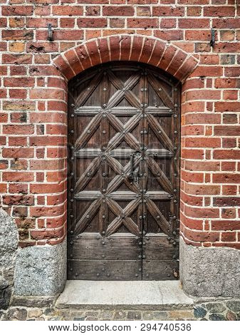 Old wooden outdoor doors - Teutonic Malbork castle, Poland 