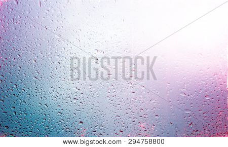 Water Drops On Blue Background / Drops Of Rain On Glass , Rain Drops On Clear Window / Colorful Abst