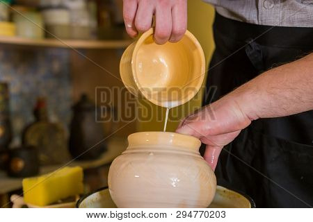 Professional Male Potter Preparing Ceramic Wares For Burning In Pottery Kiln With Milk - Old Russian