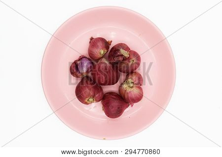 Shallot In Pink Dish On White Background.