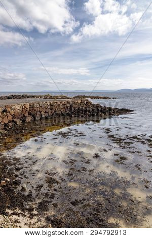 Pier And Beach In Galway Bay