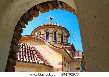 View Through The Arch Of The Church Of St. Nectarios, Greece.