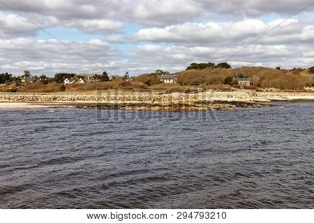 Beach With Sand And Buildings In Galway Bay