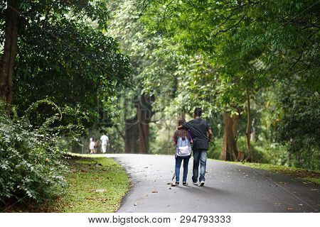 Kandy, Sri Lanka - March 17, 2018: Couple Walk In Royal Botanical Garden Is A Must See Place In Kand