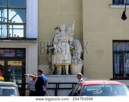 Mukachevo, Ukraine - May 3, 2018: Sculpture Of A Peasant Woman Near The Entrance To The Building Of 