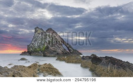 Bow-fidle Rock Sunrise Landscape On The Coast Of Scotland On A Cloudy Morning