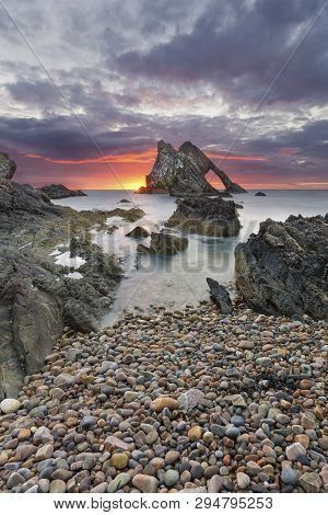 Bow-fidle Rock Sunrise Landscape On The Coast Of Scotland On A Cloudy Morning