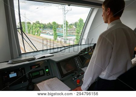 MOSCOW, RUSSIA - SEPTEMBER, 2018: The driver controls the train. Run of the train Swallow on the Moscow ring railway, MKZD.