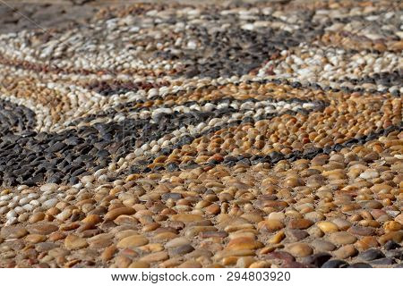 Magnificent Floor From Smooth Multi-colored Sea Pebbles. Stunning Oriental Patterns On The Floor, Li