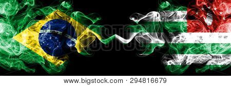 Brazil Vs Abkhazia, Abkhazian Smoke Flags Placed Side By Side. Thick Colored Silky Smoke Flags Of Br