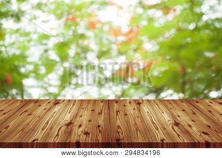 Emtry Wooden Table On Top Over Blur Natural Background, Can Be Used Mock Up For Montage Products Dis