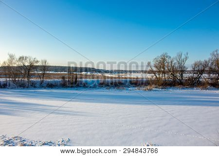 Panorama Of A Snow-covered River In A Winter Day