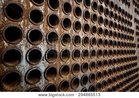 Rust Tube Sheet Of The Heat Exchanger For Maintenance, The Water Heater In The Boiler As Background