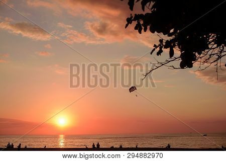 Parasaler Over The Sea In The Sunset Light.