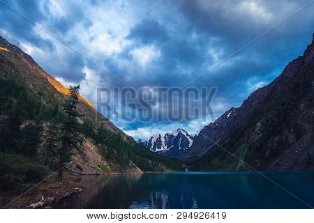 Wonderful Mountain Lake With View On Giant Glacier. Amazing Huge Mountains With Conifer Forest. Larc