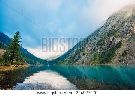 Wonderful Mountain Lake. Amazing Huge Mountains With Conifer Forest. Larch Tree On Water Edge. Morni