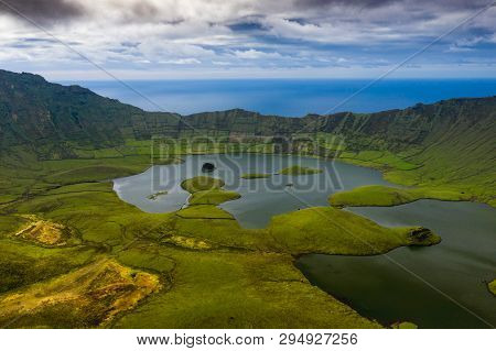 Aerial View Of Volcanic Crater (caldeirao) With A Beautiful Lake On The Top Of Corvo Island. Azores
