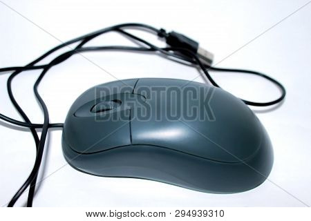 Computer Wired Mouse Dark Gray On A White Background Lies