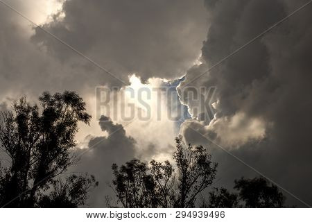 Multiple Exposure Of An Opening In The Overcasted Sky Wich Allows The Sun To Project Some Of Its Lig