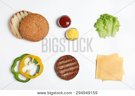 Composition With Burger Ingredients On White Background, Top View
