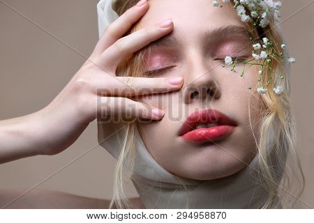 Beautiful Model With Light Pink Eyeshades Closing Eyes While Posing