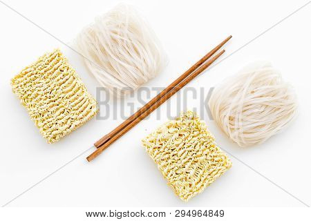 Chinese, Japanese Food Cooking With Rice Vermicelli, Noodles And Sticks On White Background Top View