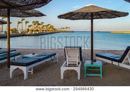 Deckchairs And Parasols On A Beach Of The Red Sea In Hurghada Egypt