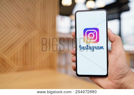 Chiang Mai, Thailand - Mar. 23,2019: Man Holding Xiaomi Mi Mix 3 With Instagram Application On The S