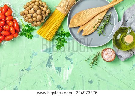 Spaghetti, Shimeji Mushroom, Tomatoes, Olive Oil,  Pink Salt, Empty Ceramic Bowl, Wooden Spoons For 