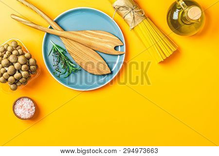Spaghetti, Shimeji Mushroom, Olive Oil,  Pink Salt, Empty Ceramic Bowl, Wooden Spoons For Salad Over