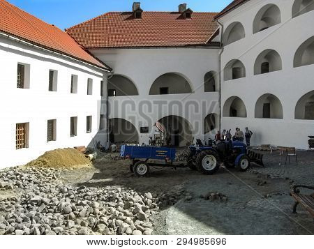 Mukachevo, Ukraine - May 3, 2018: Paving Works In The Courtyard Of Medieval Castle Palanok. Small Tr