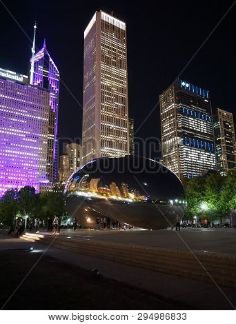 Chicago, Il, Usa - May 24, 2018 - The Bean (cloud Gate) At Millenium Park At Night With Buildings On