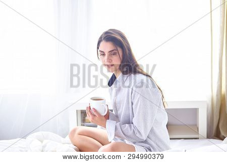 Young Beautiful Happy Brunette Woman In Black Silk Dressing Gow