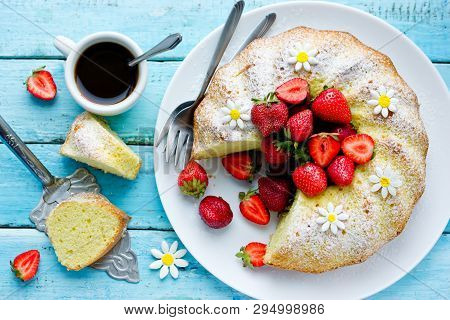 Classic Vanilla Bundt Cake With Strawberries And Powdered Sugar Top View