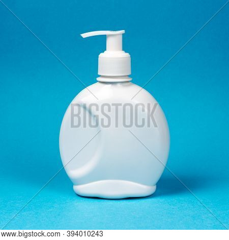 White Bottle, Dispenser For Liquid Soap, Antiseptic On A Blue Background. Mockup, Place For Text. Sq