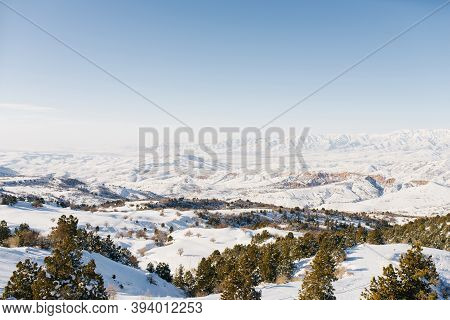 Panorama Of Snowy Slopes Covered With Snow In Sunny Weather. Winter Landscape In The Mountains Of Th