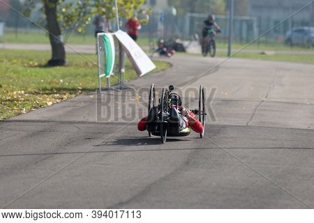 Disabled Athlete Training With His Handbike On A Track.