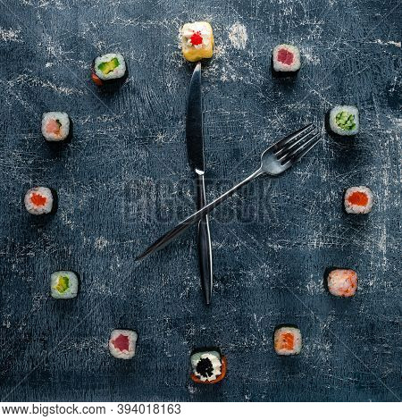 Sushi Time In The Form Of A Wall Clock On A Concrete Background, Sushi Clock With Fork And Knife, Co