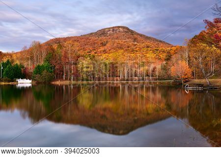 Mt. Yonah, Georgia, USA from Chambers Lake in autumn at dusk.