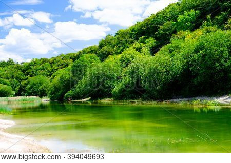 Beautiful Abstract Landscape Of Houghton Regis Quarry's Lake In Bedfordshire.