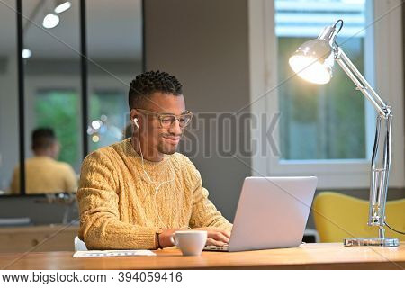 Portrait of african american trendy guy in a distant online call