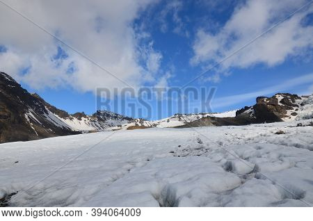 Icefloe On Top Of A Volcanic Mountain Peak In Iceland.