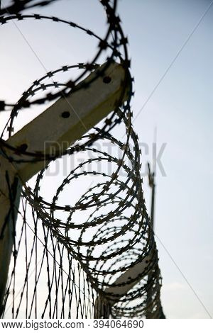 Mata De Sao Joao, Bahia / Brazil - November 8, 2020: Concertina Wire Fence Is Seen In An Industrial 