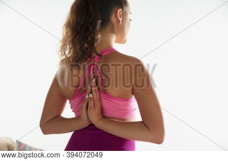 Balanced. Beautiful Young Woman Working Out Indoors, Doing Yoga Exercise On Gray Mat At Home. Long H