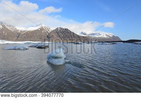 Elevated Lake In Iceland Icefloe Floating In It.