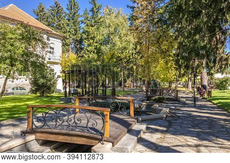 Razlog, Bulgaria - October 20, 2020: Downtown Street Panoramic View With Autumn Trees And Bridge